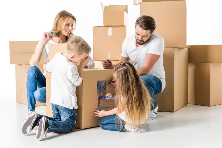 Family packing moving boxes